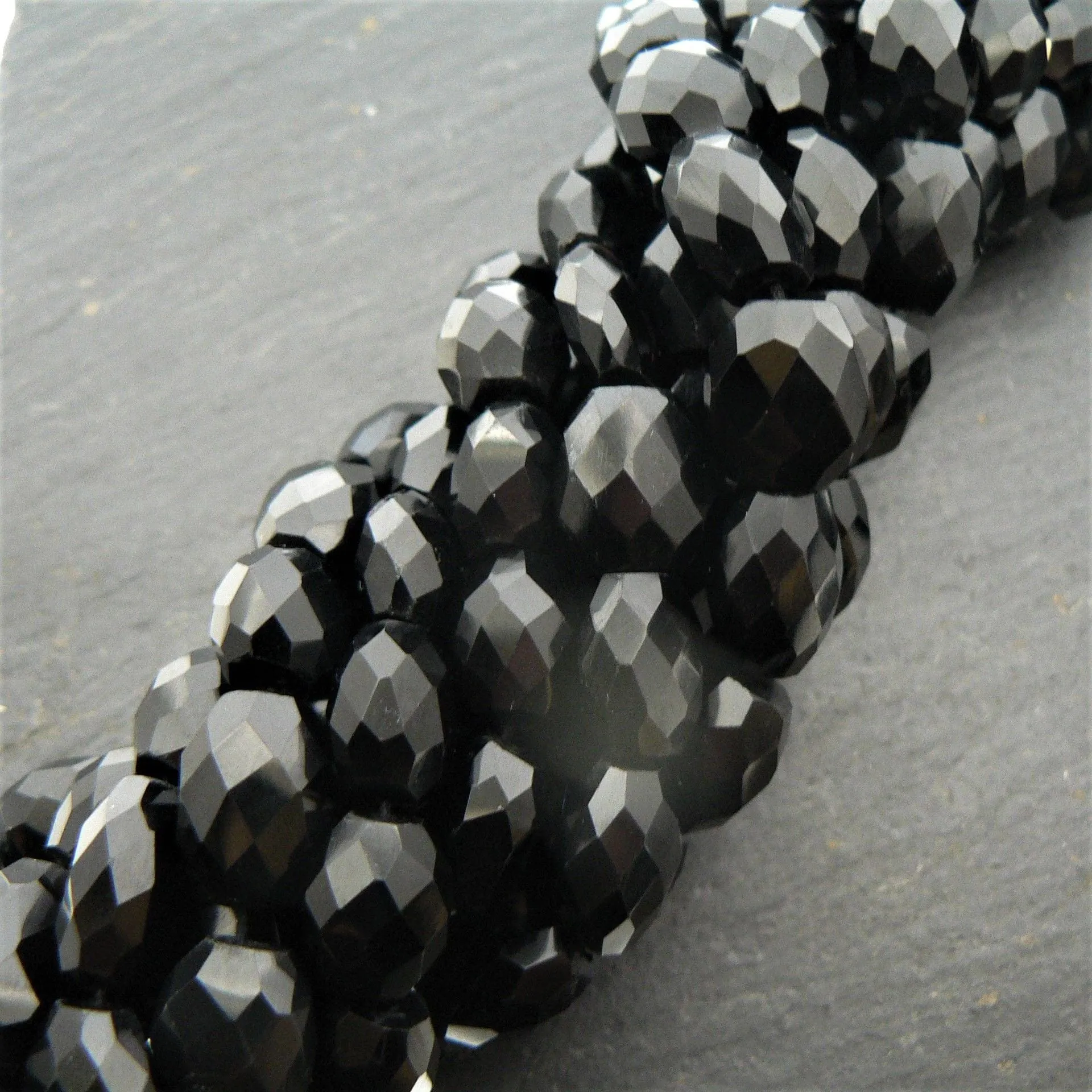 Black Onyx Faceted Oval Beads 15" Strand