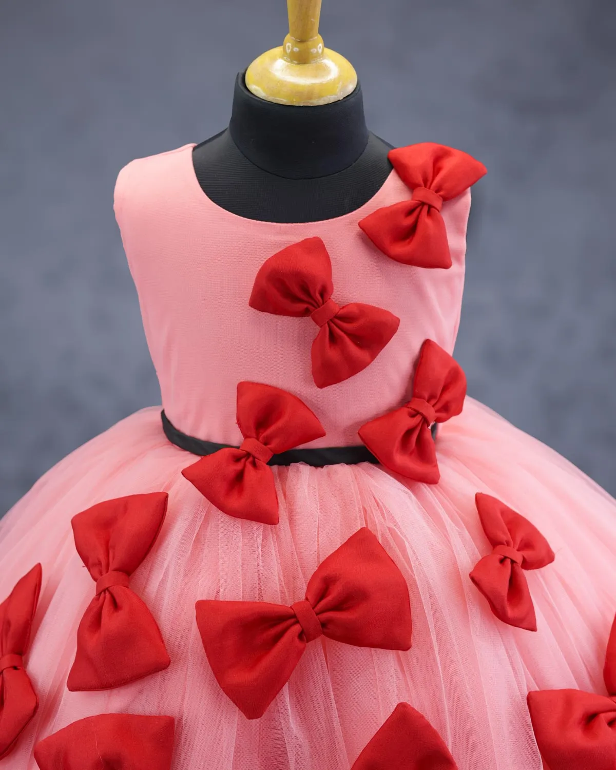 Coral and red bow design gown